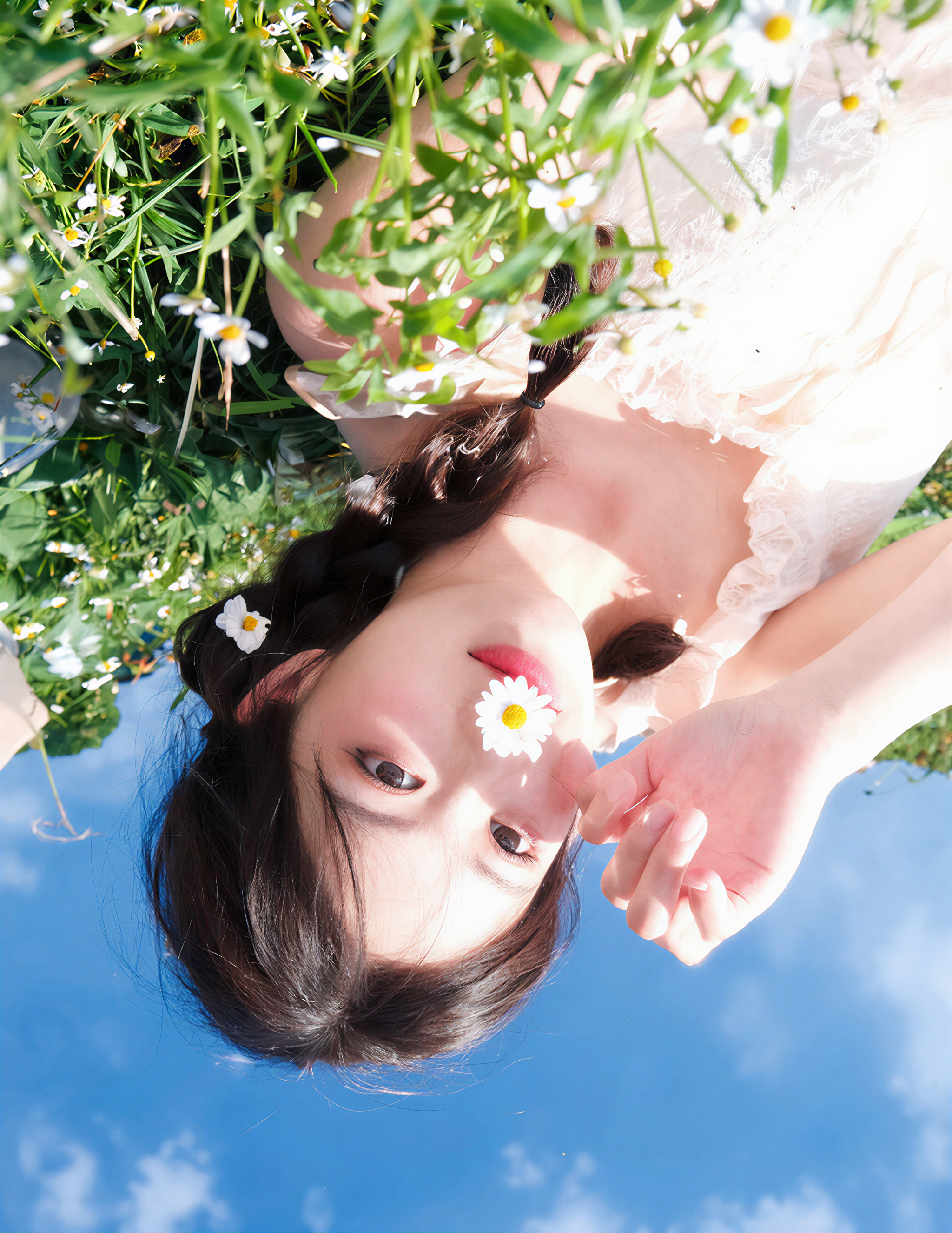 高细节写实写真，低角度仰拍，扎双麻花辫的甜美少女穿米白蕾丝吊带裙，躺在遍布小雏菊的草地上，鼻尖放一朵小雏菊，背景是晴朗蓝天白云，柔和春日自然光，清新通透，皮肤细腻有光泽。